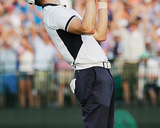 Germany’s Martin Kaymer celebrates winning the U.S. Open at Pinehurst No. 2 on Sunday in Pinehurst, N.C.
Kaymer, who set records for lowest scores in the opening rounds, shot a 1-under 69 to finish at 9-under and
eight strokes ahead of second place finishers Erik Compton and Rickie Fowler.