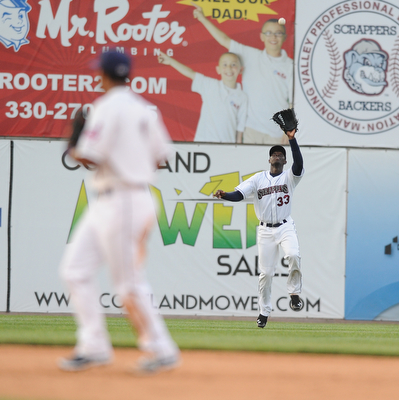 NILES, OHIO - JUNE 17, 2014: Outfielder Jorge Martinez #33 of the Scrappers peps to catch a fly ball for the 3rd out in the top of the 5th inning during Tuesday nights New York Penn League game at Eastwood Field. (Photo by David Dermer/Youngstown Vindicator) Infielder Ordomar Valdez pictured.