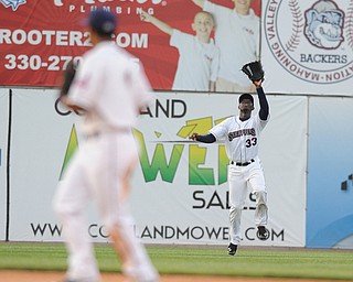 NILES, OHIO - JUNE 17, 2014: Outfielder Jorge Martinez #33 of the Scrappers peps to catch a fly ball for the 3rd out in the top of the 5th inning during Tuesday nights New York Penn League game at Eastwood Field. (Photo by David Dermer/Youngstown Vindicator) Infielder Ordomar Valdez pictured.