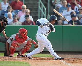 NILES, OHIO - JUNE 17, 2014: Batter Francisco Mejia #27 of the Scrappers loses the grip of his bat while swinging it in the bottom of the 2nd inning during Tuesday nights New York Penn League game at Eastwood Field. (Photo by David Dermer/Youngstown Vindicator)