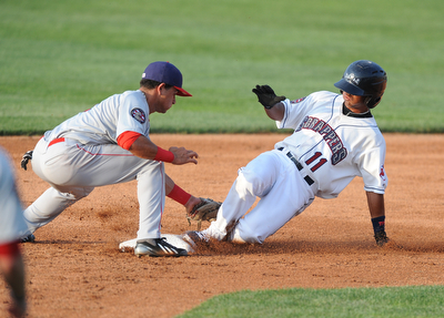 NILES, OHIO - JUNE 17, 2014: Base runner Ordomar Valdez #11 of the Scrappers slides into second base for a double beating the tag of infielder Bryan Mejia #1 of the Doubledays in the bottom of the 3rd inning during Tuesday nights New York Penn League game at Eastwood Field. (Photo by David Dermer/Youngstown Vindicator)