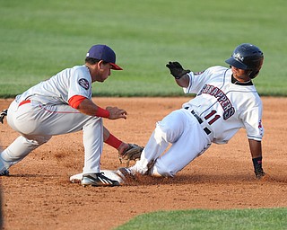 NILES, OHIO - JUNE 17, 2014: Base runner Ordomar Valdez #11 of the Scrappers slides into second base for a double beating the tag of infielder Bryan Mejia #1 of the Doubledays in the bottom of the 3rd inning during Tuesday nights New York Penn League game at Eastwood Field. (Photo by David Dermer/Youngstown Vindicator)