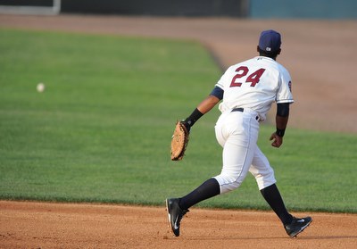 NILES, OHIO - JUNE 17, 2014: Infielder Juan De La Cruz #24 of the Scrappers watches as the baseball rolls into the outfield after getting past his glove on a line drive in the top of the 4th inning during Tuesday nights New York Penn League game at Eastwood Field. (Photo by David Dermer/Youngstown Vindicator)