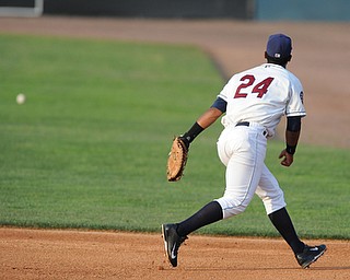 NILES, OHIO - JUNE 17, 2014: Infielder Juan De La Cruz #24 of the Scrappers watches as the baseball rolls into the outfield after getting past his glove on a line drive in the top of the 4th inning during Tuesday nights New York Penn League game at Eastwood Field. (Photo by David Dermer/Youngstown Vindicator)