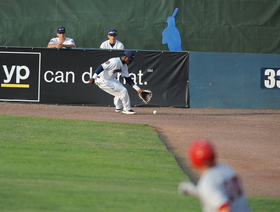 NILES, OHIO - JUNE 17, 2014: Outfielder D'Vone McClure #1 of the Scrappers chases down the ball in the corner while base runner Cody Gunter #10 of the Double days runs to second base for a double in the top of the 4th inning during Tuesday nights New York Penn League game at Eastwood Field. (Photo by David Dermer/Youngstown Vindicator)
