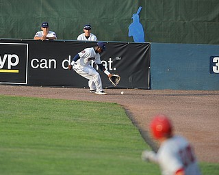 NILES, OHIO - JUNE 17, 2014: Outfielder D'Vone McClure #1 of the Scrappers chases down the ball in the corner while base runner Cody Gunter #10 of the Double days runs to second base for a double in the top of the 4th inning during Tuesday nights New York Penn League game at Eastwood Field. (Photo by David Dermer/Youngstown Vindicator)