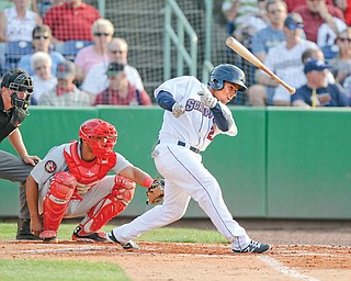 Scrappers batter Francisco Mejia loses the grip of his bat while swinging during Tuesday’s home opener against Auburn at Eastwood Field in Niles. Watching are umpire Mac Dietz and catcher Raudy Reed.