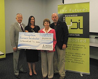 SPECIAL TO THE VINDICATOR
Home Savings Charitable Foundation has donated $10,000 to the Youngstown Business Incubator. From left are Richard Schiraldi, chairman of the board, UCFC; Pamela Kimmel, director, Home Savings Charitable Foundation; Barb Ewing, COO, YBI; and James Cossler, CEO and chief evangelist, YBI.