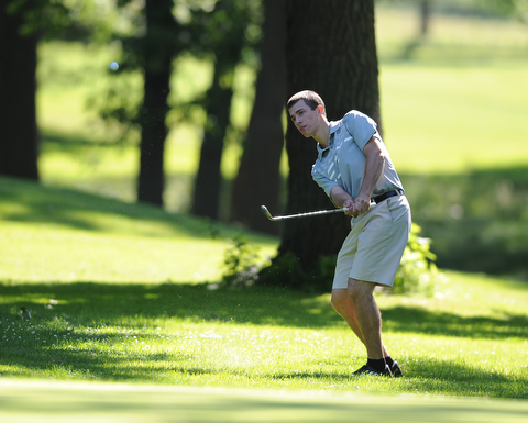 HERMITAGE, PENNSYLVANIA - JUNE 20, 2014: Vincent Leone of Canfield chips his ball from the short rough to the green on the 1st hole Friday morning at Tam O'Shanter golf course during the Vindy Greatest Golfer tournament. (Photo by David Dermer/Youngstown Vindicator)