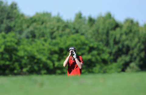 HERMITAGE, PENNSYLVANIA - JUNE 20, 2014: Zach Jacobson of Poland uses his range finder to find the distance to the green from the fairway on the 5th hole Friday morning at Tam O'Shanter golf course during the Vindy Greatest Golfer tournament. (Photo by David Dermer/Youngstown Vindicator)