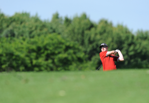 HERMITAGE, PENNSYLVANIA - JUNE 20, 2014: Zach Jacobson of Poland follows through with his shot after shooting from the fairway to the green on the 5th hole Friday morning at Tam O'Shanter golf course during the Vindy Greatest Golfer tournament. (Photo by David Dermer/Youngstown Vindicator)
