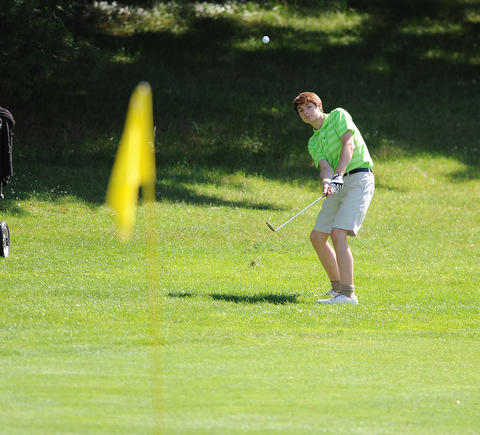 HERMITAGE, PENNSYLVANIA - JUNE 20, 2014: Tavish Brude of Warren chips out of the short rough and toward the green on the 17th hole Friday morning at Tam O'Shanter golf course during the Vindy Greatest Golfer tournament. (Photo by David Dermer/Youngstown Vindicator)