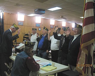 SPECIAL TO THE VINDICATOR: American Legion Post 737 intalled officers for 2014-2015 at its June 5 meeting. Facing left, from left, are Joe Leonard, treasurer; Bill Cameron, adjunct; Bud Bittinger, second vice president; Bob Hughes, first vice president; and James Boehmer, commander. Standing and facing the officers is Gary Mellows, past district commander, who did the swearing in. Sitting and observing was George Street III, chaplain. A meal was served after the meeting.