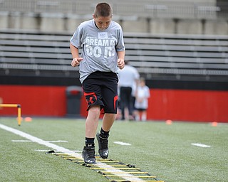 YOUNGSTOWN, OHIO - JUNE 21, 2014: Robert Coonce works on quick feet in a rope drill during the Brad Smith Football Camp at Stambaugh Stadium on the campus of Youngstown State Saturday morning. (Photo by David Dermer/Youngstown Vindicator)