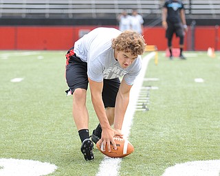 YOUNGSTOWN, OHIO - JUNE 21, 2014: Joey Zelinski picks up the football to score during the Brad Smith Football Camp at Stambaugh Stadium on the campus of Youngstown State Saturday morning. (Photo by David Dermer/Youngstown Vindicator)