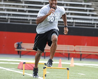 YOUNGSTOWN, OHIO - JUNE 21, 2014: Brad Smith clears a hurdle during a drill during the Brad Smith Football Camp at Stambaugh Stadium on the campus of Youngstown State Saturday morning. (Photo by David Dermer/Youngstown Vindicator)