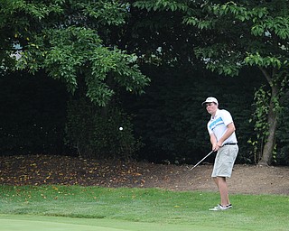 SALEM, OHIO - JUNE 23, 2014: Ethan Grim of Western Reserve chips his ball onto the green on the 17th hole on Monday afternoon at the Salem Golf Club during the Vindy Greatest Golfer tournament. (Photo by David Dermer/Youngstown Vindicator)
