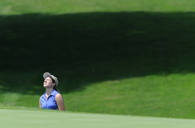 SALEM, OHIO - JUNE 23, 2014: Rachel Russell of Howland reacts after a bad shot and failing to get onto the green out of the bunker Monday afternoon at the Salem Golf Club during the Vindy Greatest Golfer tournament. (Photo by David Dermer/Youngstown Vindicator)