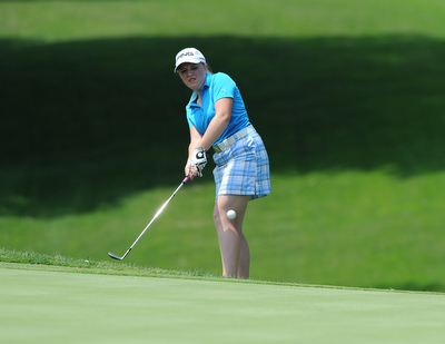 SALEM, OHIO - JUNE 23, 2014: Kaci Carpenter on Canfield chips onto the green from the short rough on Monday afternoon at the Salem Golf Club during the Vindy Greatest Golfer tournament. (Photo by David Dermer/Youngstown Vindicator)