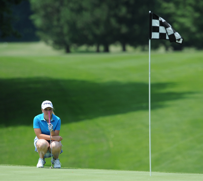 SALEM, OHIO - JUNE 23, 2014: Kaci Carpenter on Canfield lines up her shot on the green on Monday afternoon at the Salem Golf Club during the Vindy Greatest Golfer tournament. (Photo by David Dermer/Youngstown Vindicator)