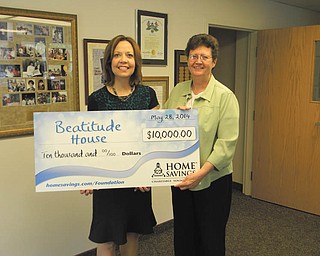 SPECIAL TO THE VINDICATOR
Sister Janet Gardner, right, executive director of the Beatitude House, recently accepted a $10,000 gift from Home Savings Charitable Foundation’s main branch manager, Trish Mohan. Beatitude House plans to use the funds for its transitional housing program for homeless women. For information about Beatitude House call 330-744-3147 or visit beatitudehouse.com.