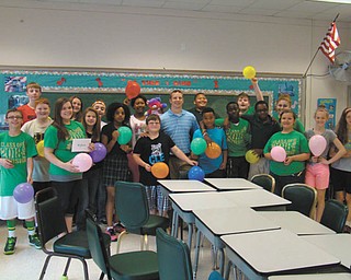 SPECIAL TO THE VINDICATOR
The junior high students at St. Patrick School in Hubbard recently surprised social studies teacher Matt Green, center, with a wedding shower in honor of his upcoming nuptials. A buffet lunch and cake were enjoyed by the students and Green, and students presented him with gift cards.