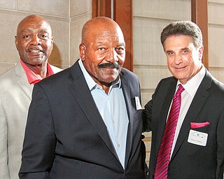 From left, former Cleveland Browns Reggie Rucker and Jim Brown attended the Edward J. DeBartolo Memorial
Scholarship Foundation’s dinner with Phantoms Fireworks CEO Bruce Zoldan at Stambaugh Auditorium.