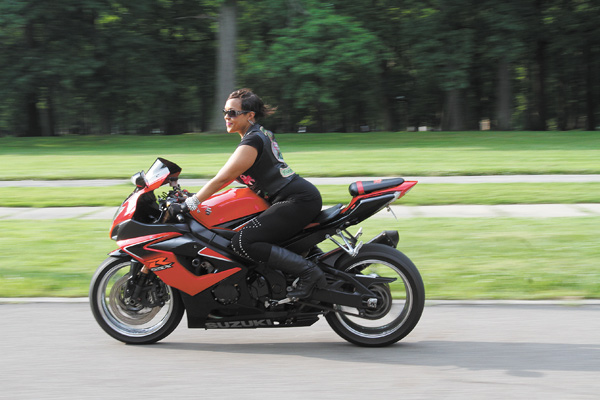 Courtney Brown, whose nickname is “Red,” is vice president of Dangerous Curvez MC Inc. She rides a Suzuki GSXR 1000.