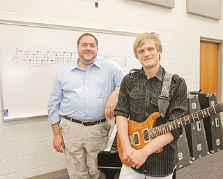 For his senior capstone project, 18-year-old Nick Frank, who graduated from Lowellville High School earlier this month, composed a piece of music that was performed by his school’s concert band. With him is Bob Antonucci, Lowellville’s band teacher and a mentor for Frank’s project.