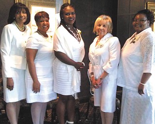 The Links inductees, above, were required to attend orientation workshops and pass a
rigorous test before their induction. During the ceremony, each inductee was presented with a white rose, the flower that symbolizes The Links. After the induction, they each
received a Links pin and numerous gifts from their Links sisters. From left are Ruthie King, Ursula Perdue, Dr. Sabine Barlatt, Audrey Gillian and Theresa Yarboro.