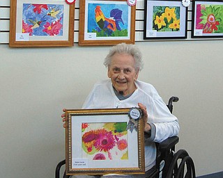 SPECIAL TO THE VINDICATOR
Helen Lucas, 100, of Austintown, above, won a Juror’s Choice Award. Winning an award for Creativity was Janet Freisen of Austintown, at left.