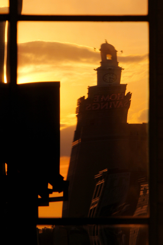 William D. Lewis The Vindicator The Home Savings building is reflected in a window of the PNC building at sunset in downtown Youngstown.