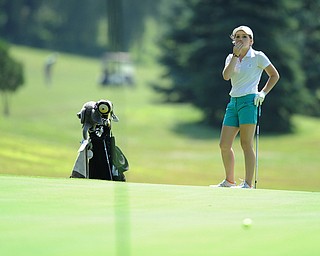 CANFIELD, OHIO - JUNE 30, 2014: Cait Butler of Canfield reacts after watching her long putt fall shot of the hole on the 7th hole Monday morning at Diamondback Golf Course during the Vindy Greatest Golfer of the Valley tournament. (Photo by David Dermer/Youngstown Vindicator)