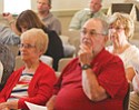 The audience listens as Mahoning County officials present their rationales for a three-quarter percent sales tax on the Nov. 4 ballot in McMahon Hall at the Mill Creek MetroParks Farm in Canfield.