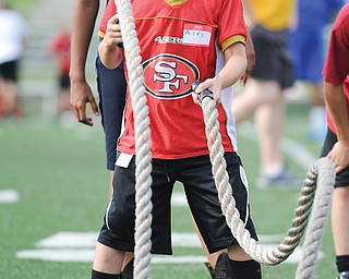 Alex Zordich of Boardman works on a rope drill Monday morning during the Cardinal Mooney Camp of
Champions at Mooney High School.