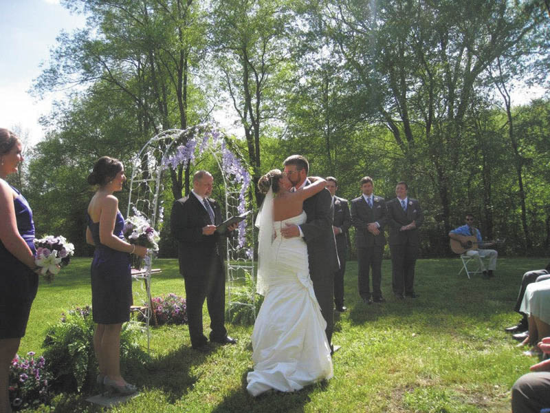 Allyson Rust-1: Sharing their first kiss as husband and wife are Allyson and Luke Rust. The outside wedding took place in front a house built in the 1800s in Mercer, Pa., and the reception followed in the barn in the back yard. The couple made and set up all the decorations, which made the day more meaningful to them.