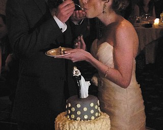 Dr. and Mrs. Vincent Peyko are enjoying a piece of custom lemon cake made by the best man and Vincent's brother, John Peyko, owner of D.B.C, a Cakery, of Boardman. Sent by John.