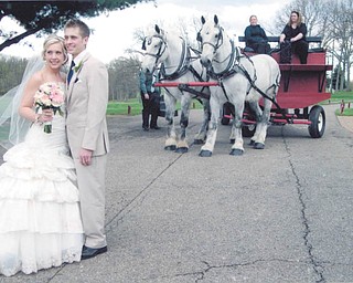 The former Natalie Swingler and her new hubby, Steven Holden, on their wedding day, May 3. It had been a dreary day, and then the sun appeared just as the ceremony was about to start. Sent by great-aunt Mary Lou Korenich.