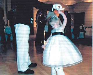 Groomsman Capt. Richard Alderson is dancing with the flower girl, Alivia Massie, who is wearing her snow boots at her aunt and uncle's wedding in Lake Tahoe. Sent by Alivia's grandparents, Joe and Linda Massie of Boardman.
