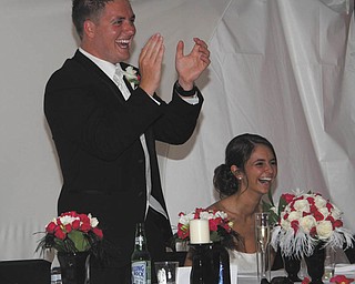 Patty Crago, the bride's mother, took this picture when the best man, Dunn, sang a song he wrote for the couple as his speech as best man. The couple are Jeneane and Brent Hugus, who celebrated their fifth wedding anniversary June 20. All live in Canfield.