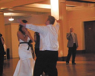 Kara Krispinsky and Zac Middletown were married on Oct. 12, 2013, in Columbus. The photo was taken by Kara's mother, Carole Krispinsky, as they were dancing their first dance as husband and wife when Zac stepped back and sang to her, "I can't believe that I'm your man and I get to kiss you, baby, just because I can." It was a touching moment.