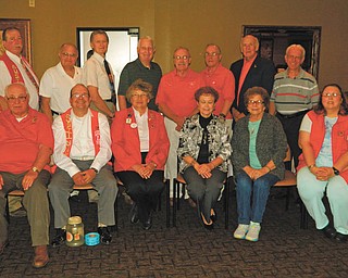 SPECIAL TO THE VINDICATOR
Austintown Lions and Lioness clubs installed officers and celebrated the Lions’ 37th Charter Anniversary at a banquet June 16 at Rachel’s Restaurant in Austintown. King Lion Bill Sywy presided. District 13-D Governor-elect Barbara Sorken, from Rootsown Lions Club, was the installing officer. Officers, sitting from left, are Bob Whited, membership and public relations; Jim Banyots, tail twister; Sorken; Lori Stone, Lioness president; Lou Skerkavich, Lioness vice president; and Teresa McCallen, Lioness secretary. Standing are Harold Wilson, secretary; Sywy; Larry Jensen, treasurer and Lioness liason; Bob Melcher, first vice president; Jack Kochansky, second vice president; Don Hoelzel, Lion tamer; Glenn Ringer, two-year director; and John Facemyer, one-year director. Below is Sywy, left, presenting the Lion of the Year award to Facemyer.