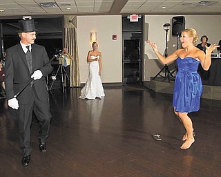 Phil Blanco is admiring his daughters, Angela Blanco Smith, right, and Kimberly Blanco Porter, in the background, at Kimberly's wedding. Sent by mom, Rochelle Blanco of Boardman.