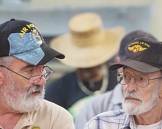 Vietnam veteran Gene Stoesser, right, talks with Veterans Crisis Command Center volunteer Chuck Lewi while he waits for an appointment at American Legion Post 1 in Phoenix.