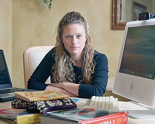 Jennifer Wedel of Fort Worth, Texas, is photographed at her home after chatting with President Barack Obama via Google. Wedel challenged Obama on the H-1B visa issue in 2012, making headlines when she asked him via a public online chat about the number of foreign workers being hired, given that her husband, a semiconductor engineer, couldn’t find work.