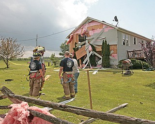 A house had an entire side blown off , and damage to the roof caused ceilings to cave into the home on the 9300 block of Akron-Canfield Road in Ellsworth Township on Tuesday afternoon. The storm went through the townships of Ellsworth and Canfield as well as the city of Canfield.