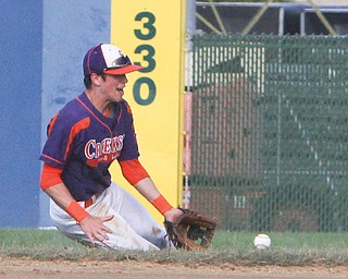 Ted Williams of Creekside makes a sliding stop down the right-field line during a Class B 18-under-under game against the Ohio Glaciers on Tuesday night at Bob Cene Park in Struthers. Creekside won the first game, 10-2.