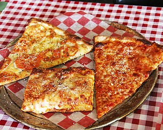 Time-tested family recipes are used for both the tomato sauce and dough used for the Italian Village’s variety of pizzas. Patrons can choose a thin crust or a thick Sicilian crust.
