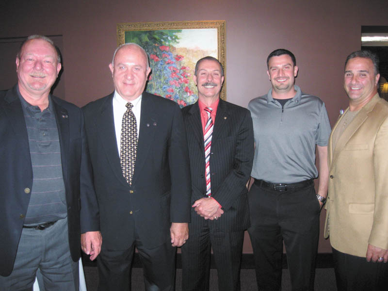 Officers for the Rotary Club of Austintown were installed recently for the 2014-2015 year. Above, from left to right, are Chuck Baker, who installed the officers; Mal Culp, president elect; John Mashiska, chairman of vocational service; Richard Begalla, chairman of international service; and Vince Colaluca, president. Below, from left to right, are Ed Kalaher, chairman of club service; Heather Fronk, chairwoman of community service; Tracie Kaglic, secretary; and Baker.
