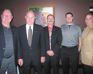 Officers for the Rotary Club of Austintown were installed recently for the 2014-2015 year. Above, from left to right, are Chuck Baker, who installed the officers; Mal Culp, president elect; John Mashiska, chairman of vocational service; Richard Begalla, chairman of international service; and Vince Colaluca, president. Below, from left to right, are Ed Kalaher, chairman of club service; Heather Fronk, chairwoman of community service; Tracie Kaglic, secretary; and Baker.
